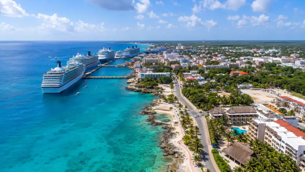 Aerial view of Cozumel cruise port coastline with cruise ships docked along turquoise Caribbean water